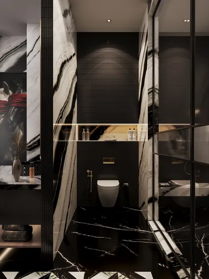 The toilet is enclosed in a space clad with the same dramatic black and white marble, creating a seamless and immersive experience. A gold-accented niche adds a touch of warmth.