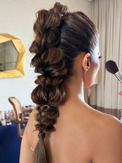 A close-up of the intricate weaving of the pull-through braid, a true work of hair art.
