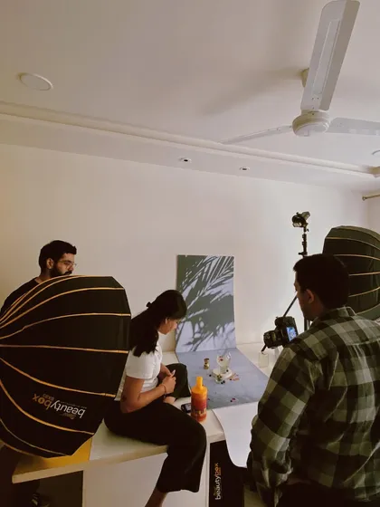 Here’s a peek behind the curtain. Collaboration is everything in my process. This shot captures the energy on set, where we get hands-on with lighting, composition, and styling to bring our shared vision to life.