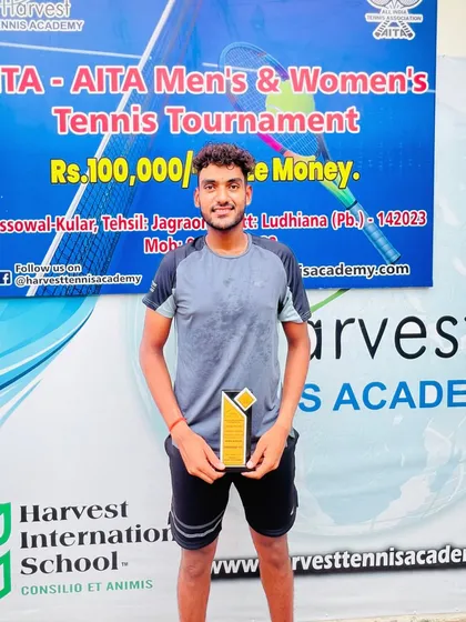 A solo shot of Maan Kesarwani with his runners-up trophy from the AITA 1 Lac Singles tournament, reflecting on a solid week of tennis.