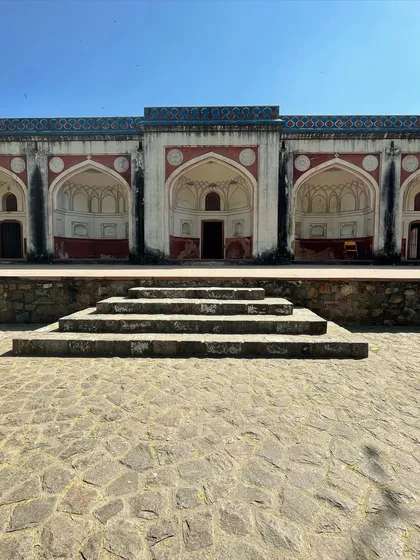 The facade of the main tomb in the Batashewala Complex, Sunder Nursery. The red and buff sandstone with white marble inlay is characteristic of early Mughal architecture.