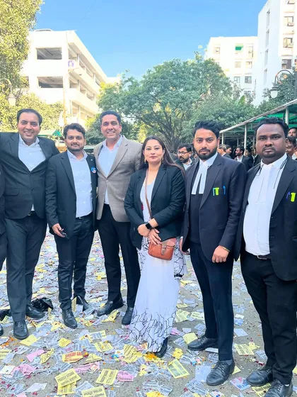 A picture from Nomination Day, surrounded by colleagues and supporters. The ground is covered in campaign pamphlets, a testament to the vibrant democratic process within our bar.