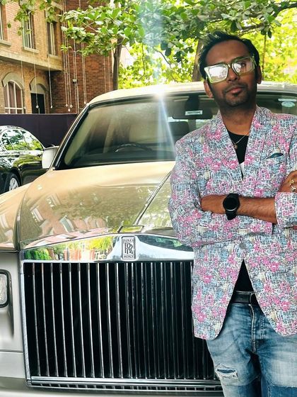 Posing with a Rolls Royce before our performance for Eagle Eye Networks. We are accustomed to performing at high-end corporate events.