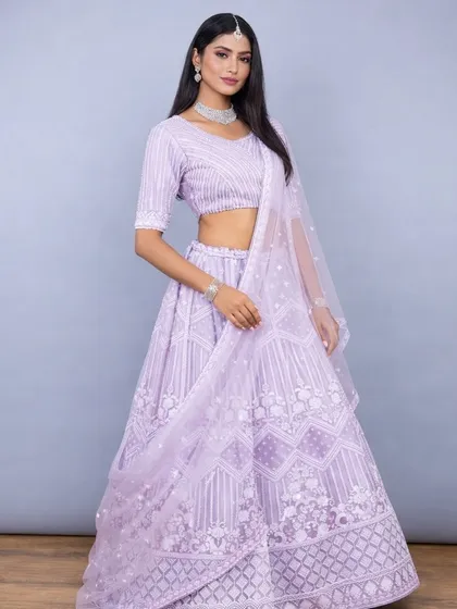 This shot showcases the modern yet traditional feel of the lavender lehenga, perfect for a day wedding or an elegant evening function.
