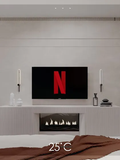 The minimalist bedroom with an integrated fireplace, presented without text. The clean lines of the fluted console, the wall sconces, and the warmth of the fire create a perfect blend of modern design and comfort.