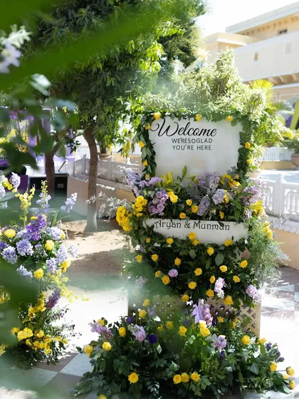 A duplicate of the welcome sign (ID 6), this time in a wider context, showing how it anchors the entrance to the event space.