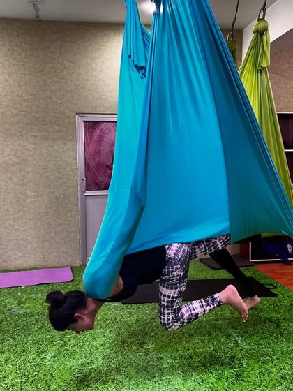 Limitations only exist if you let them. This deep inversion, with the body folded into the hammock, is a powerful way to release the spine and challenge your body.