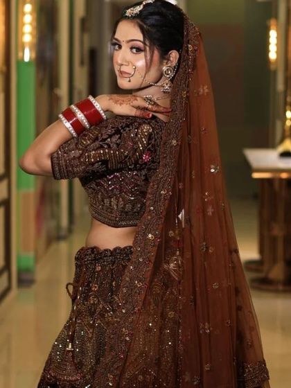 A back view of the brown velvet lehenga, showing the elegant dupatta and blouse design. This is a perfect example of the 360-degree beauty of my outfits.
