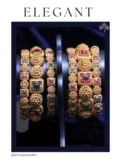 These elegant and heavy bangles with multi-colored stones are perfect for a bride.