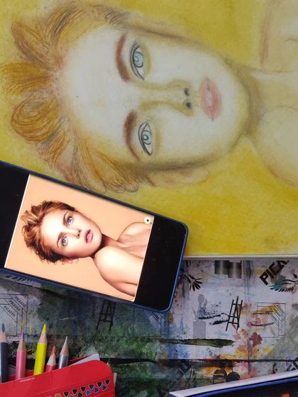 This student work demonstrates portraiture using colored pencils, blending colors to achieve a soft, painterly effect. We teach you how to use dry mediums to create rich and detailed color artwork.
