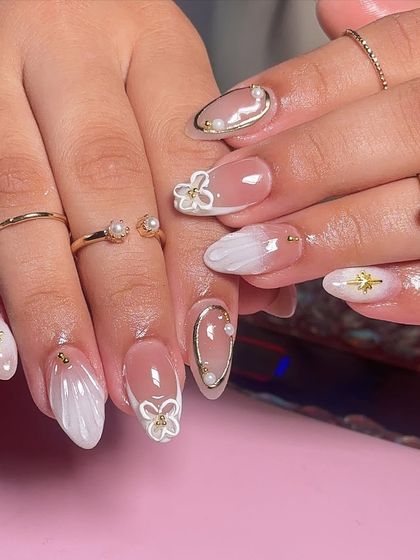 A closer look at the delicate details in this white summer set, including the gold star charms and pearls.