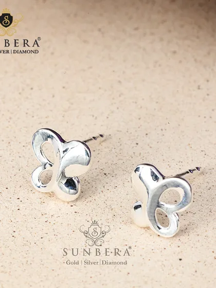Minimalist silver stud earrings in a butterfly silhouette. Their classy, chic, and simple design makes them a versatile accessory that completes any look.