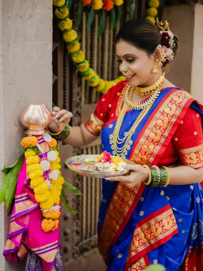 A classic Gudi Padwa portrait. The model is seen performing the rituals in her beautiful Maharashtrian attire, with a warm smile that embodies the festive spirit.