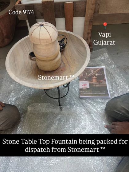 A tabletop fountain made from Teak Sandstone, which has a beautiful wood grain pattern. This piece is being packed for dispatch to a client in Vapi, Gujarat.