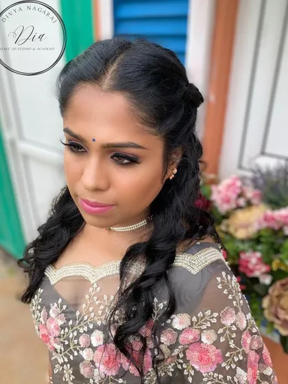 This soft glam look is perfect for outdoor photoshoots. The makeup is designed to look beautiful in natural light, with a focus on glowing skin and softly defined features.