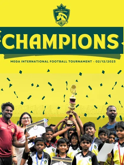 This is what we strive for. Our young football team celebrating their victory at the Mega International Football Tournament, holding the championship trophy high. We build champions from the ground up.