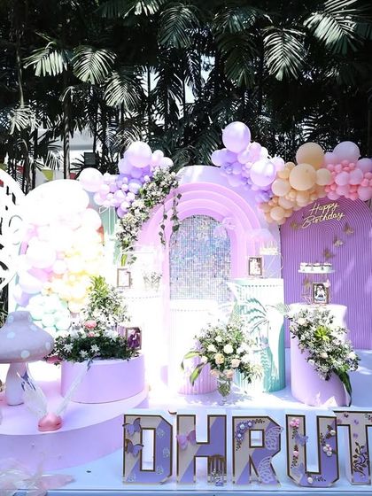 The butterfly theme is a favorite for parents blessed with a princess, and I've lost count of how many I've designed. Each time, it turns out uniquely cute, like this enchanting setup for Dhruthi.