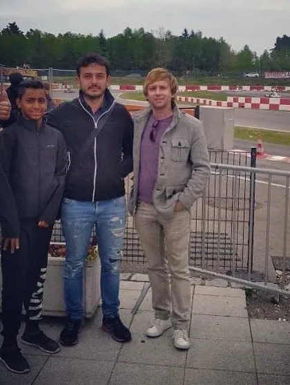 Our team supporting our driver at an international race in Germany, providing a strong support system far from home.