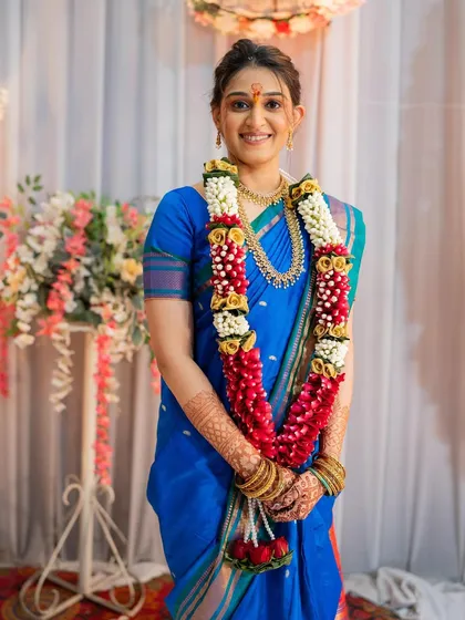 A happy, smiling portrait of the bride, showcasing her complete engagement look.