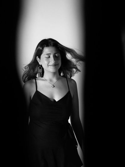 "Where does your mind go when you let it wander?" A black and white, dreamy portrait.