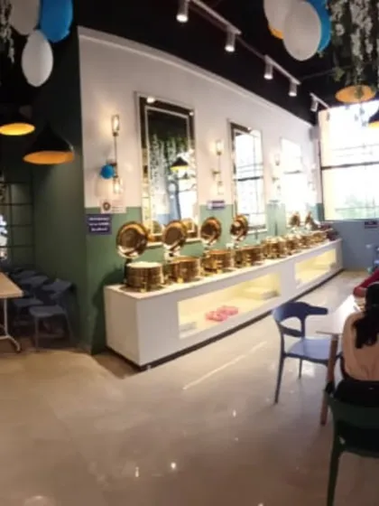 A panoramic view of the dining space, showing the buffet on one side and the seating area on the other.