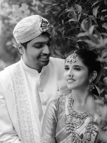 Sometimes, the most powerful moments are the quietest. This timeless black and white portrait captures an intimate glance between the couple, showcasing the simple, profound connection that is the foundation of their marriage.