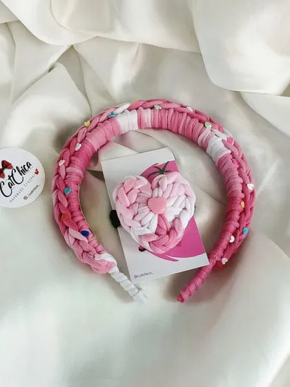 A beautiful shot of our pink Princess Braid headband and matching heart hair tie. This combo is inspired by K-Pop and Disney fashion.