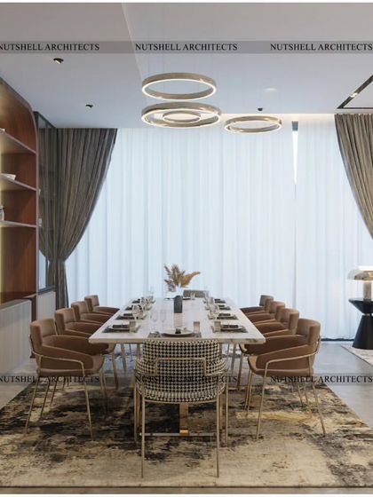 A grand space designed for entertaining, this drawing and dining room features a 10-seater dining table and seating for over a dozen guests. The large sliding glass doors connect the interior to the poolside, creating a perfect indoor-outdoor flow.