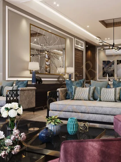 A pop of color from the velvet armchair and throw pillows adds personality and vibrancy to the neutral living space.