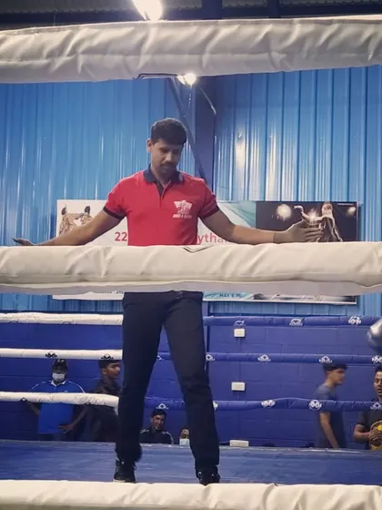 Separating the fighters during a break in the action. Maintaining control of the ring is essential for a clean fight.