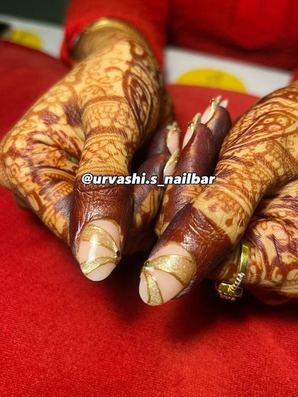 Here’s another stunning option for an engagement. The soft nude base is the perfect canvas for these sculpted gold accents and delicate gem placements, creating a look that is both traditional and modern.