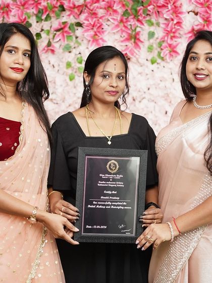 Presenting a certificate to a dedicated student from Batch 13. Her hard work and passion for makeup were evident throughout the course.