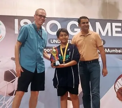 Master Zidan Shaikh receiving his 2nd Runner-Up trophy at the ISSO Games (International School's Sports Organization).