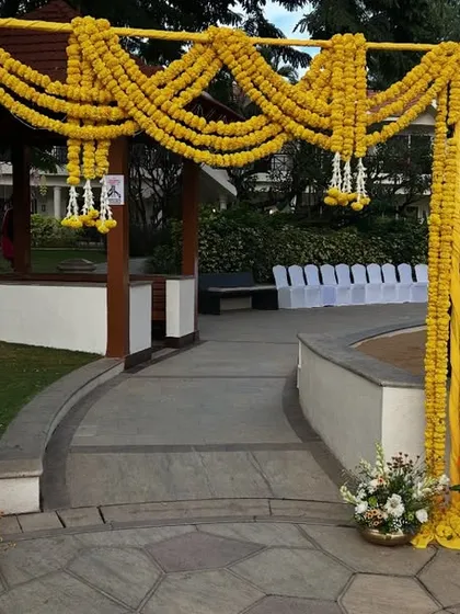 An entrance arch we created for a Haldi ceremony. We used thick garlands of yellow marigolds to build the structure, setting a traditional and welcoming tone right from the entrance of the venue.