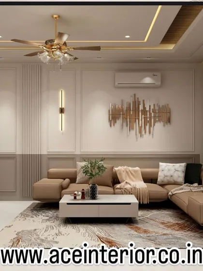 This living room demonstrates our approach to creating comfortable and elegant spaces. We combined a plush sectional sofa with refined wall molding, modern art, and a statement wall sconce to achieve a balanced and inviting atmosphere.