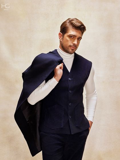 Another way to style the navy corduroy, this time with the trench coat slung over the shoulder. It's a look that speaks of confidence and modern gentlemanly style.