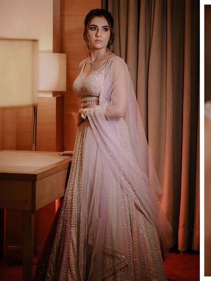 A full-length portrait of Shreya in her stunning Seema Gujral lehenga.