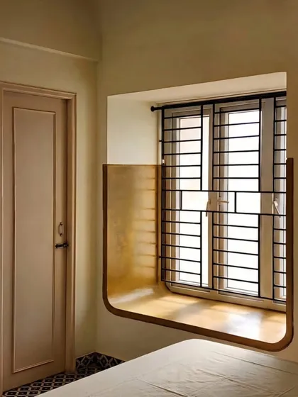 A detail from a residential interior, this built-in window seat is more than just a feature. It is a carefully crafted in-between space, a pause point designed for contemplation and connection with the outdoors, demonstrating my focus on creating architecture that enhances the quality of life.