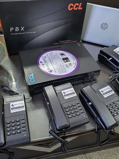 A complete EPABX system ready for installation, including the CCL PBX unit, wiring, and multiple telephone sets.