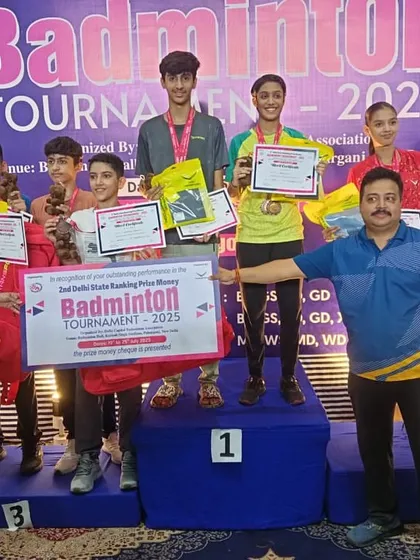 The podium is crowded with my champions at the 2nd Delhi State Badminton Tournament. This group photo captures the collective success and dominance of our academy across multiple age groups.