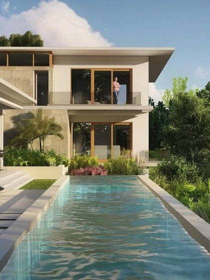 A sneak peek at a new custom farmhouse villa we are designing. This render shows a lap pool integrated with the home's living spaces, surrounded by lush landscaping.