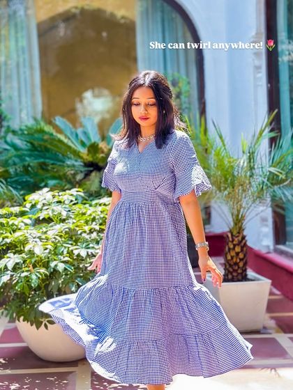 A girl who can twirl anywhere is a happy girl! This gingham print tiered dress is so fun and comfortable, perfect for a sunny day.