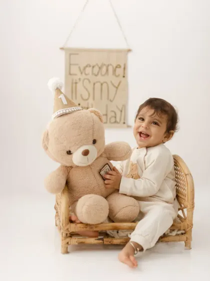 A boy and his bear celebrating a first birthday. We love incorporating favorite toys to make the session even more personal and special.