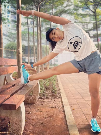 A proper warm-up is essential before any run. Here I am doing a dynamic side stretch to open up my hips and torso, ensuring my body is ready for the miles ahead.