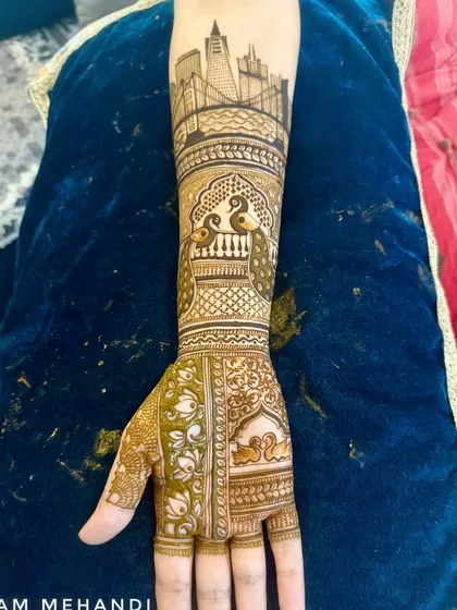 For the modern bride, I can create custom cityscapes that represent a special place. This finished henna design shows a detailed San Francisco skyline on the forearm, blended with traditional Indian motifs.