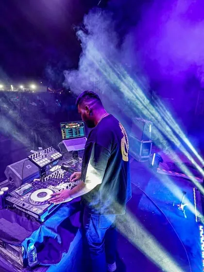 A high-angle shot of me on the Red Bull Tour Bus stage, surrounded by purple lights and smoke. The atmosphere was incredible.