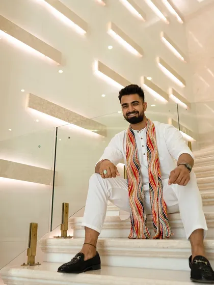 A seated pose on the marble staircase, feeling on top of the world.