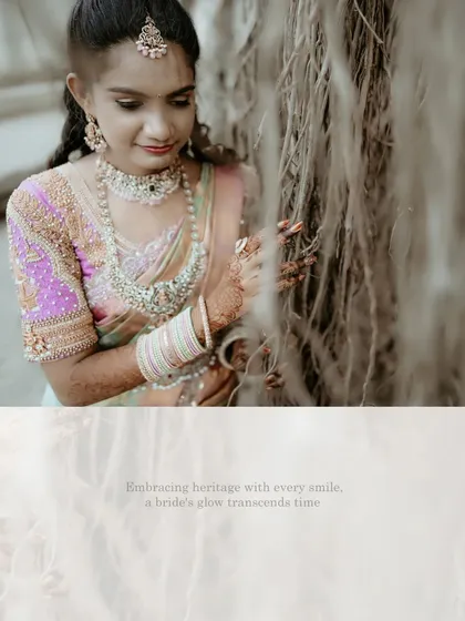 A close-up of the bride, her face partially hidden by the roots of a banyan tree, highlighting her intricate jewelry and serene expression.