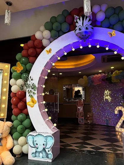 The entrance to the wild adventure. We created a custom lighted archway with animal cutouts and a themed welcome sign to build excitement from the moment guests arrive.