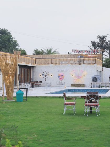 A daytime view of our spacious lawn and pool area. There's plenty of room to spread out, relax, and enjoy the open air, with the cafe just steps away.